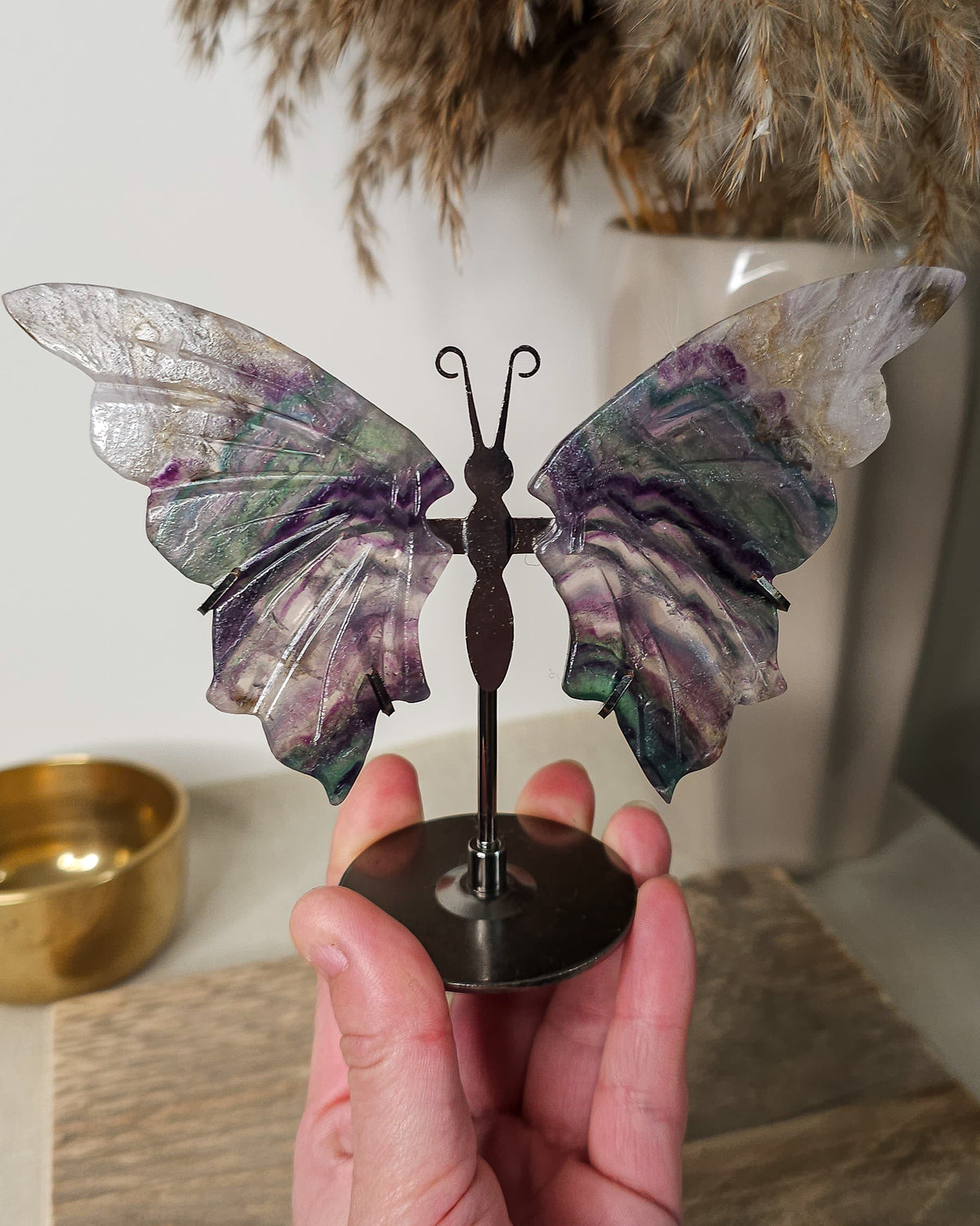 Fluorite butterfly wings on a black metal stand, featuring natural purple, green, clear and colour variations.