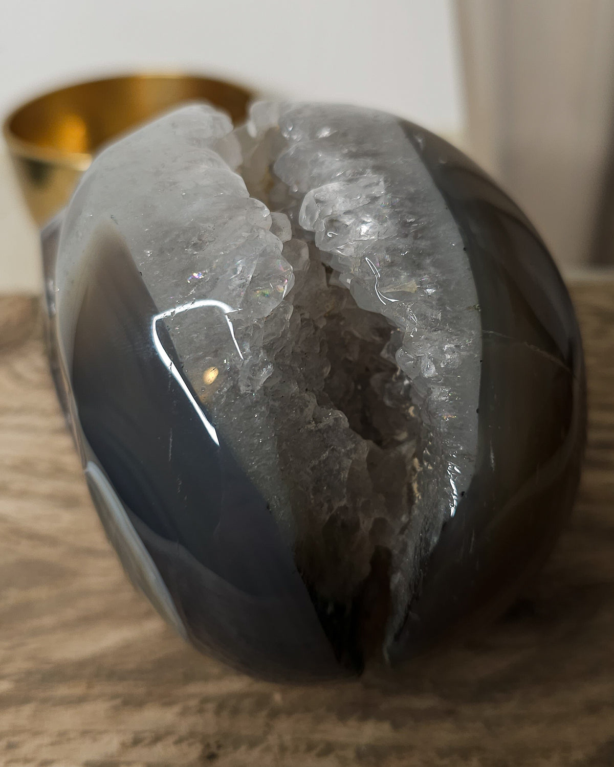 Large Druzy Agate skull carving with smoky grey and brown tones, natural white and pale blue banding, a sparkling quartz druzy cavity and tiny rainbow reflections in the crystals.