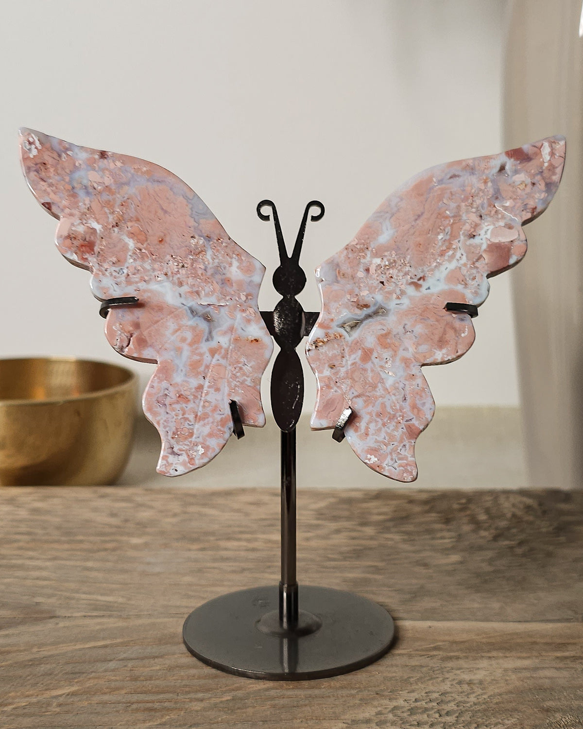 Pink Chalcedony with Agate butterfly wings on a  metal stand, featuring soft pink, cream and white natural banding.