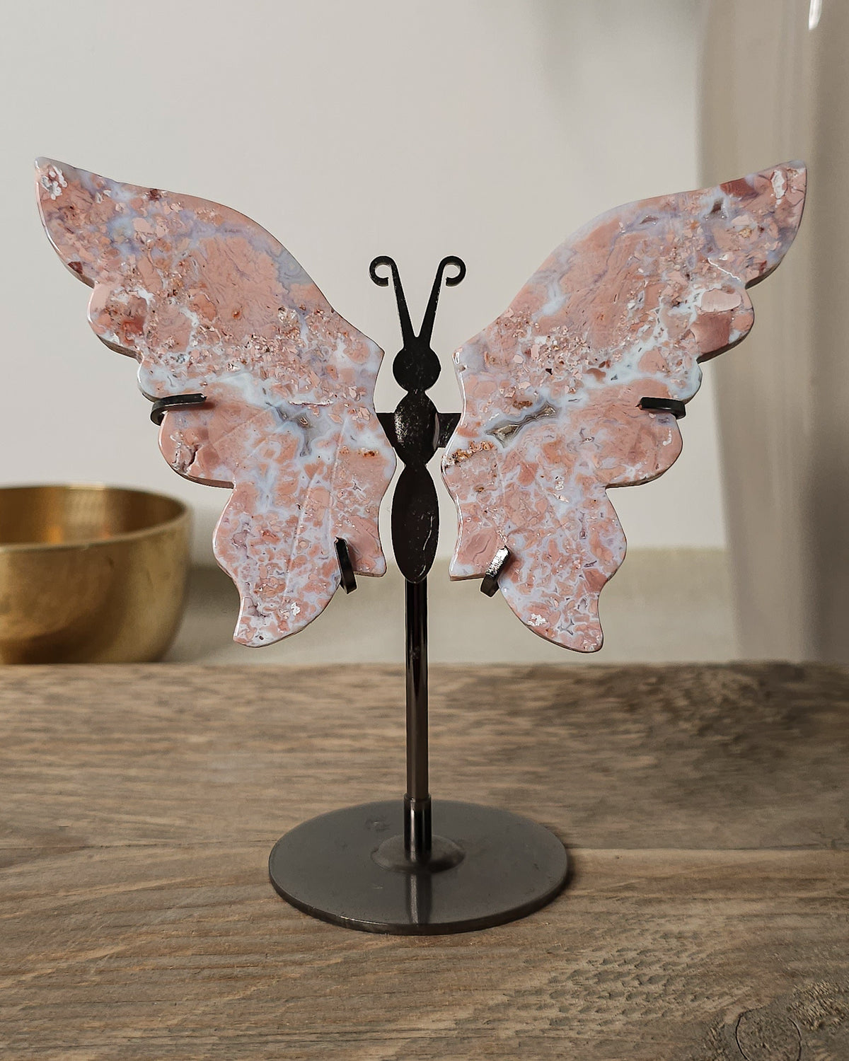 Pink Chalcedony with Agate butterfly wings on a  metal stand, featuring soft pink, cream and white natural banding.