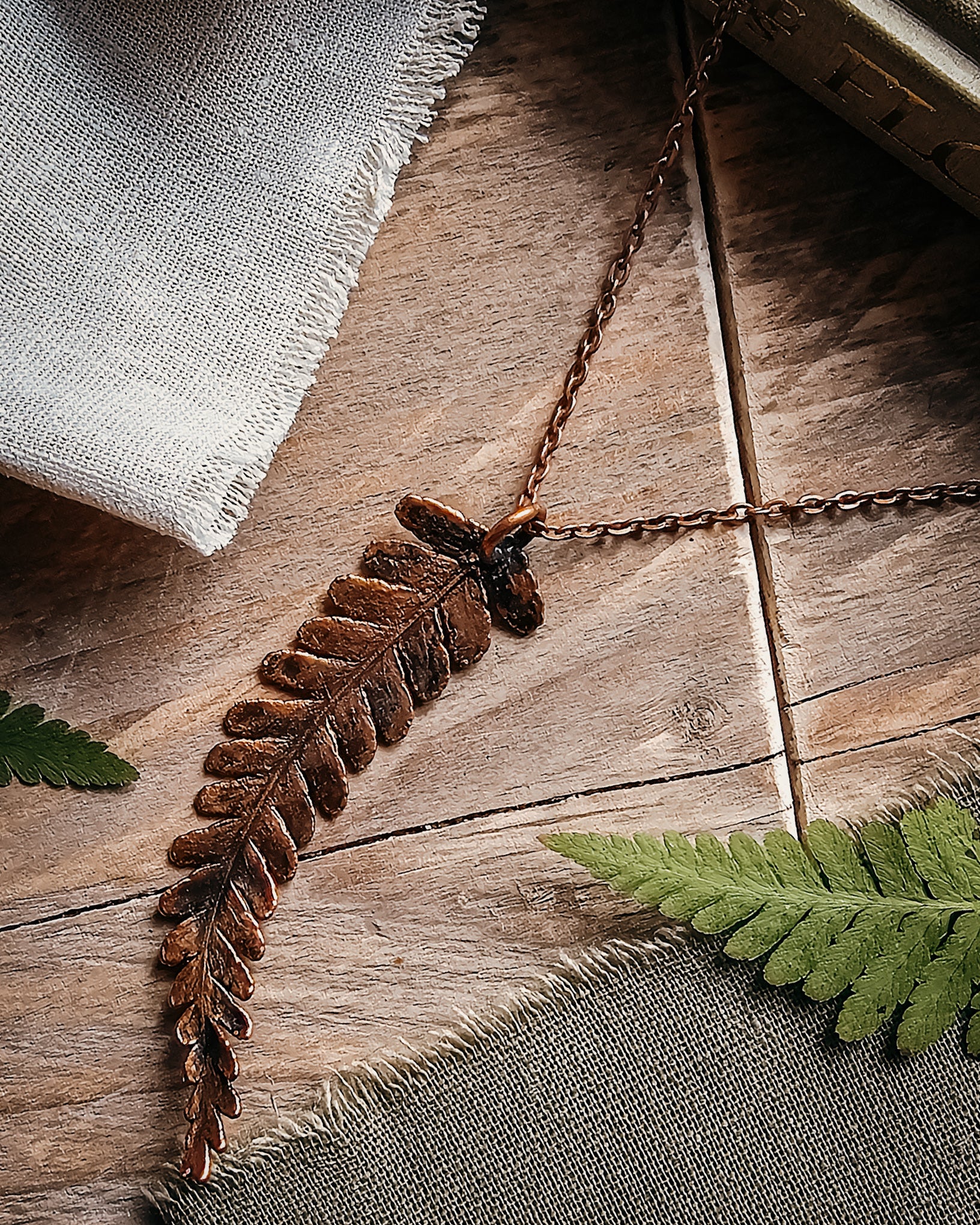 One-of-a-kind copper electroformed fern amulet, handcrafted in Scotland. A unique botanical statement necklace for nature lovers.
