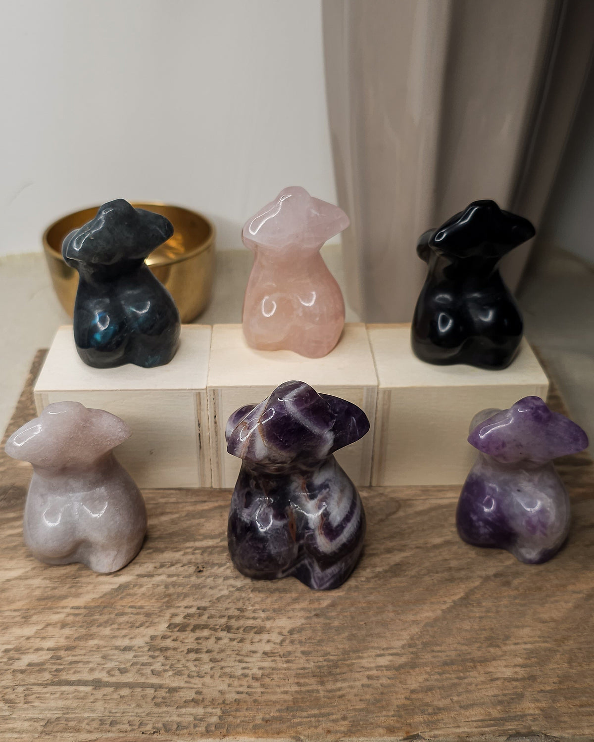 Crystal Goddess body carvings in Lepidolite, Rose Quartz, Pink Amethyst, Obsidian, Labradorite and Dream Amethyst, showing natural colours and patterns.