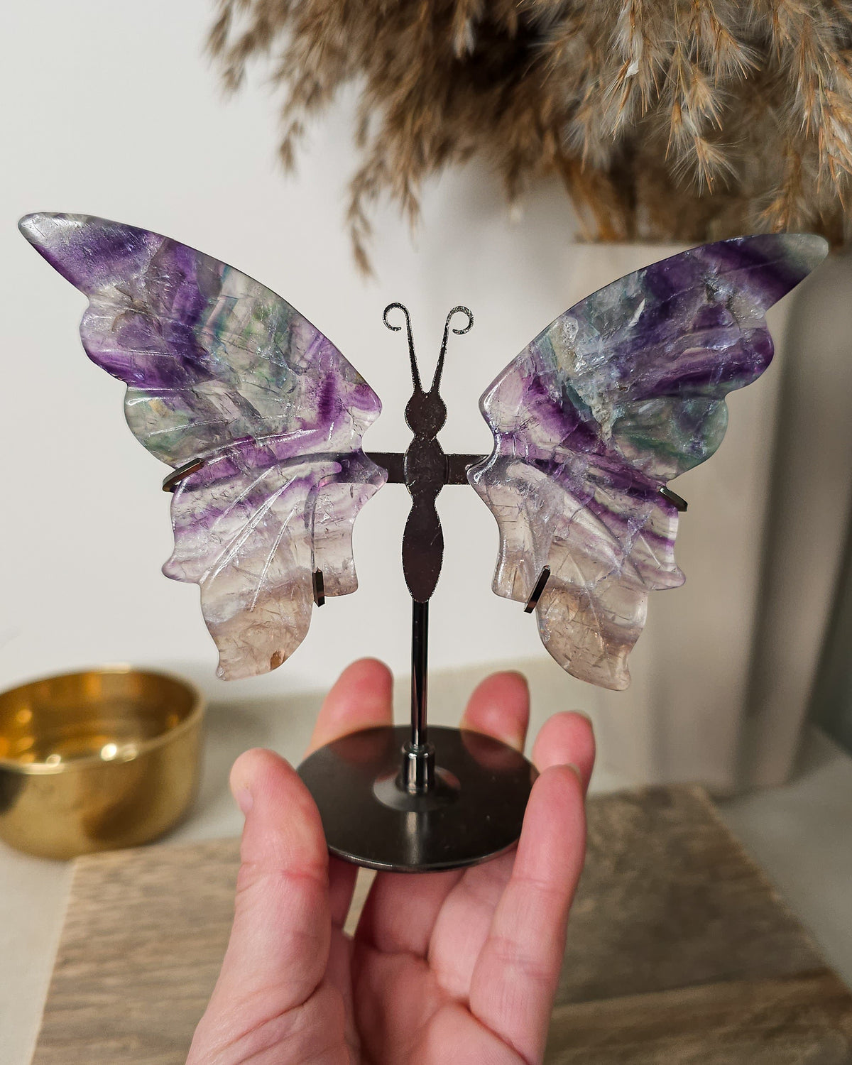 Purple Fluorite butterfly wings on a stand, with translucent layers and natural colour bands. A beautiful crystal display and gift for new beginnings
