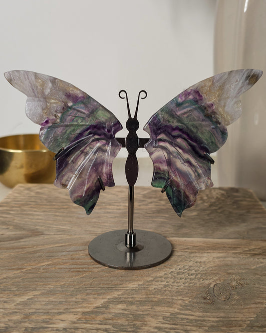 Fluorite butterfly wings on a black metal stand, featuring natural purple, green, clear and colour variations.