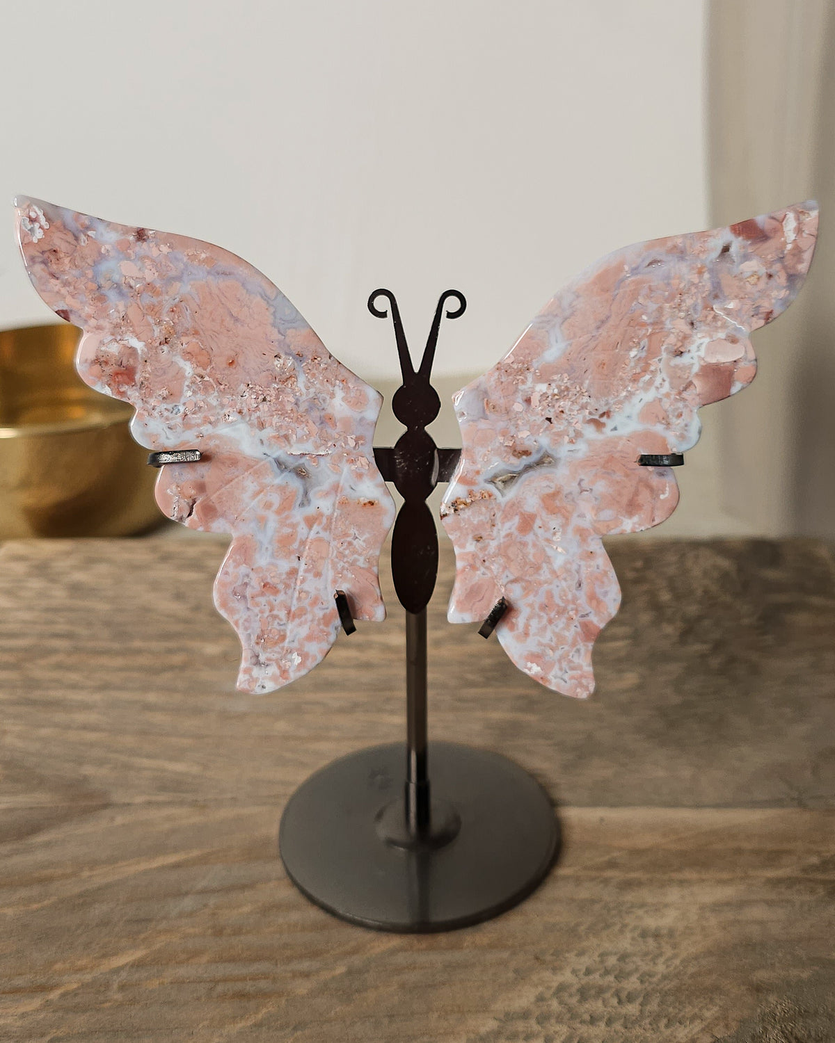 Pink Chalcedony with Agate butterfly wings on a  metal stand, featuring soft pink, cream and white natural banding.