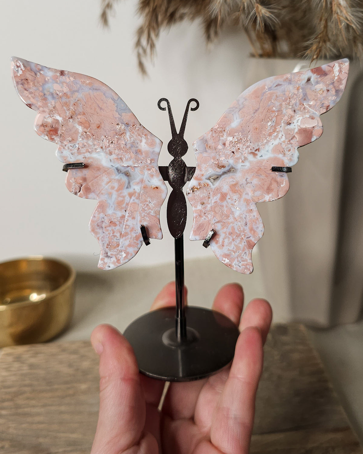 Pink Chalcedony with Agate butterfly wings on a  metal stand, featuring soft pink, cream and white natural banding.