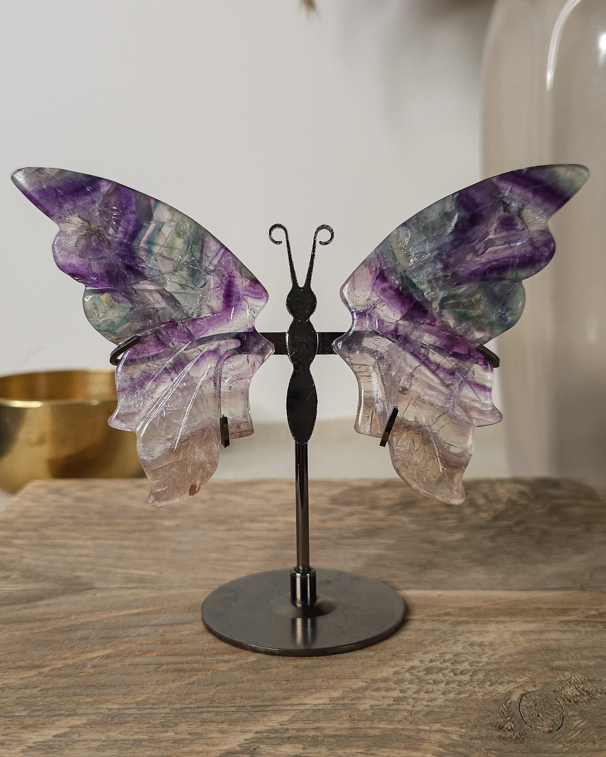 Purple Fluorite butterfly wings on a stand, with translucent layers and natural colour bands. A beautiful crystal display and gift for new beginnings.
