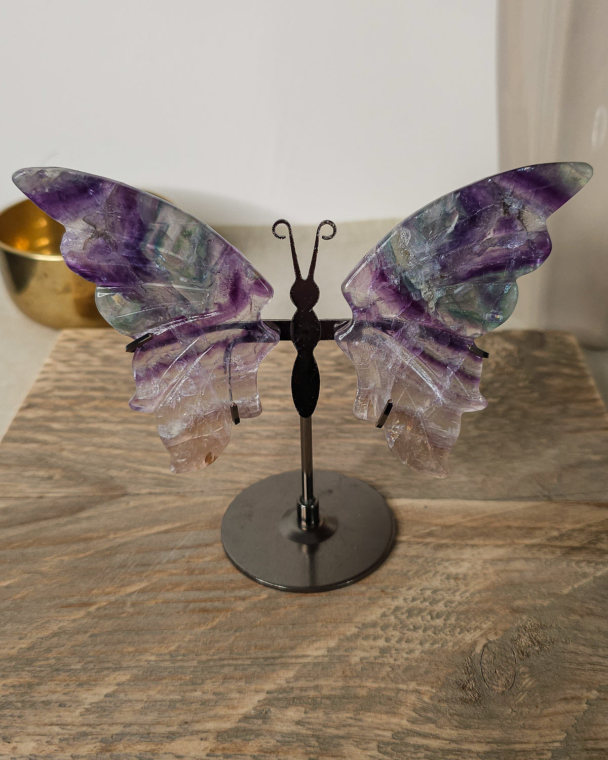 Purple Fluorite butterfly wings on a stand, with translucent layers and natural colour bands. A beautiful crystal display and gift for new beginnings.
