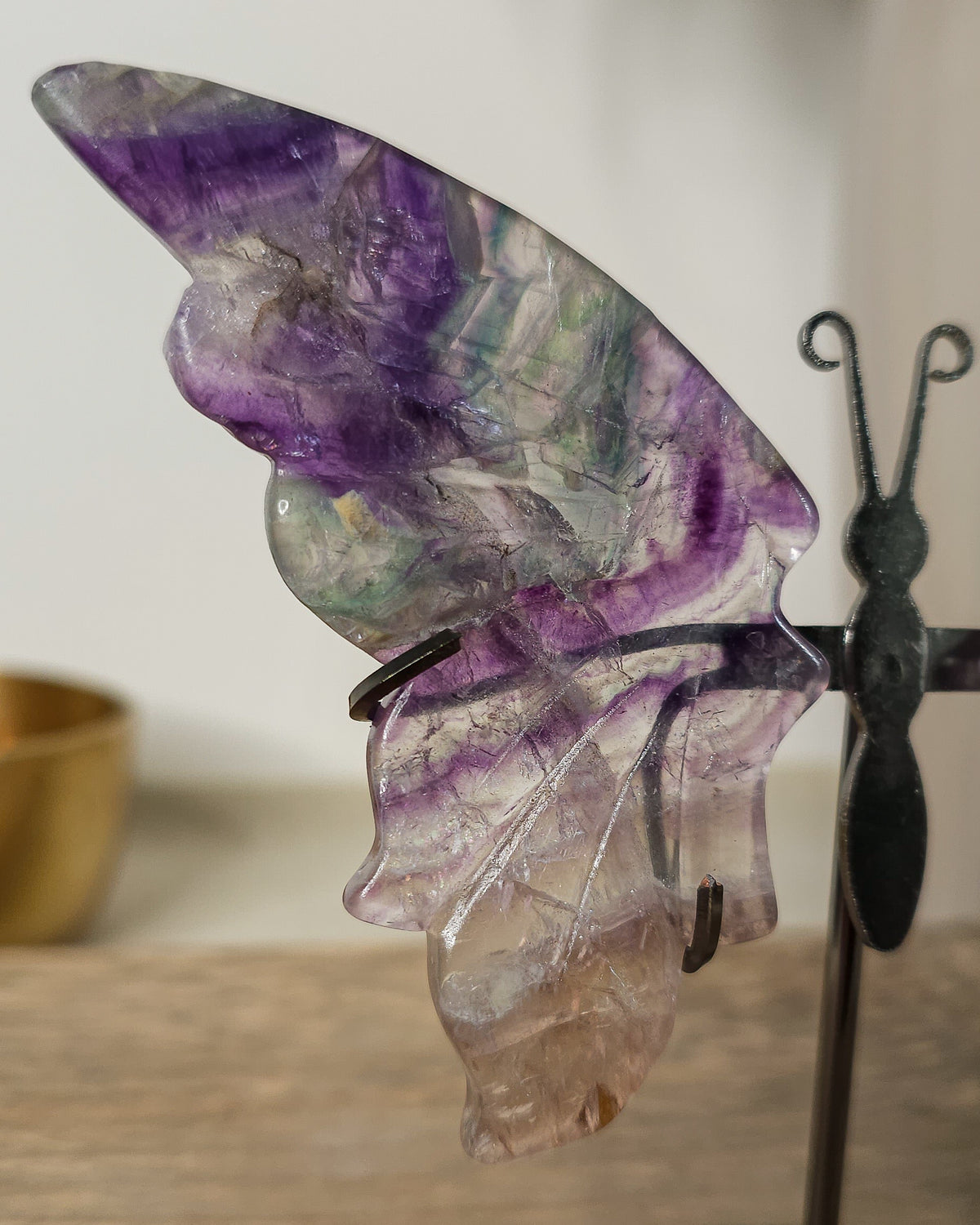 Purple Fluorite butterfly wings on a stand, with translucent layers and natural colour bands. A beautiful crystal display and gift for new beginnings.
