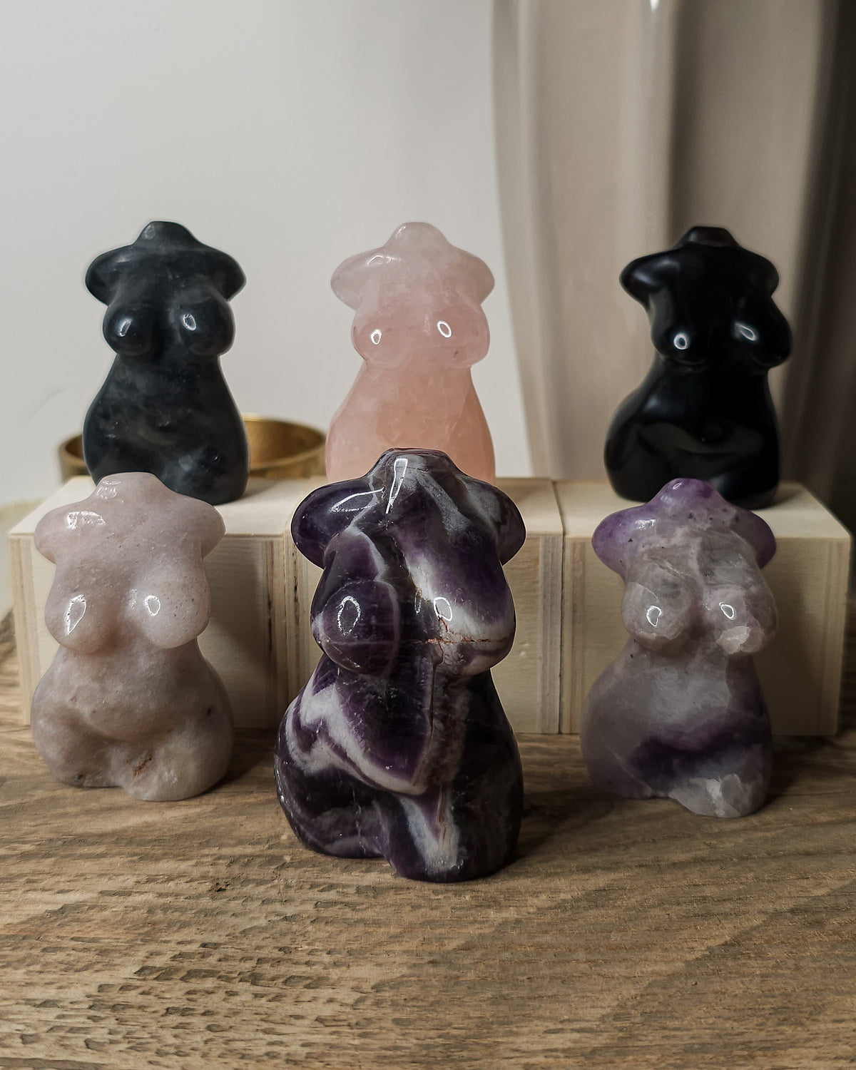 Crystal Goddess body carvings in Lepidolite, Rose Quartz, Pink Amethyst, Obsidian, Labradorite and Dream Amethyst, showing natural colours and patterns.. 