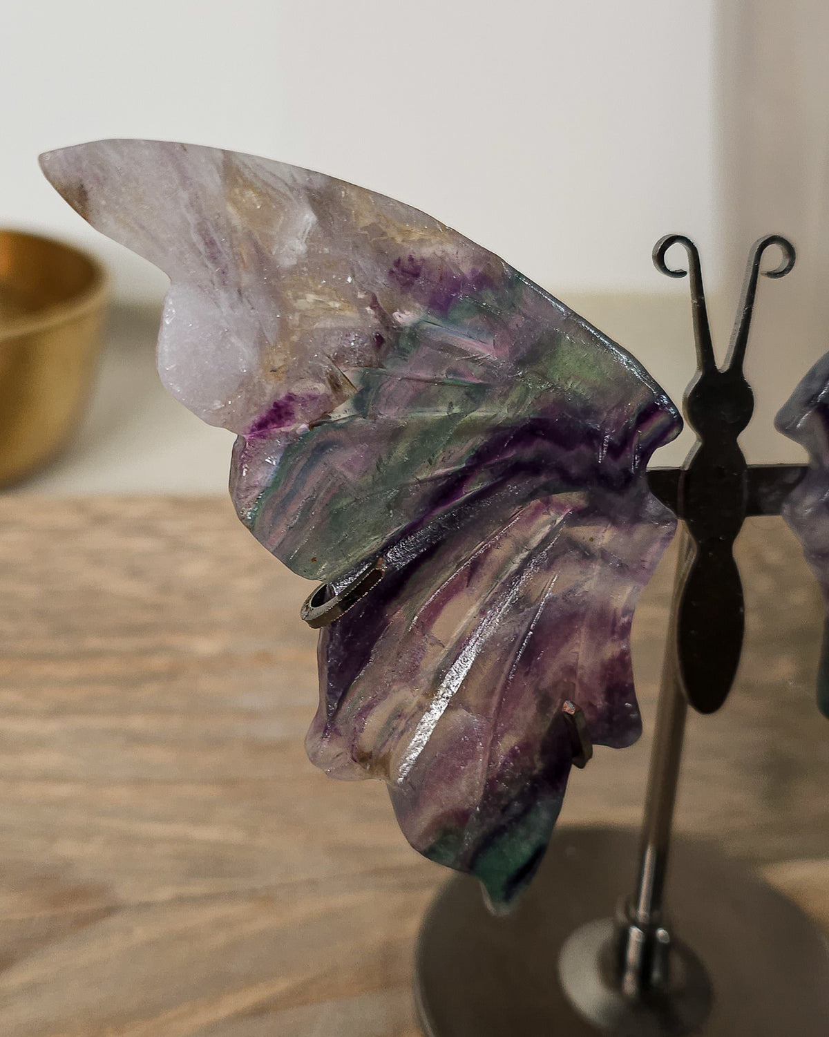 Fluorite butterfly wings on a black metal stand, featuring natural purple, green, clear and colour variations.