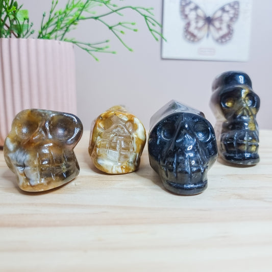 Golden Healer and Smoky Quartz Skulls